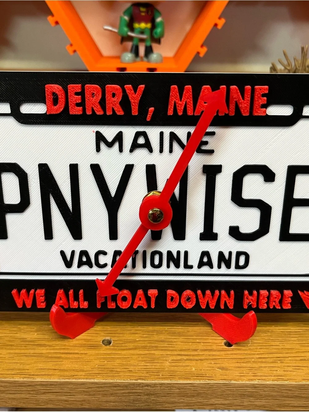 Red Accent 'DERRY, MAINE' Novelty Wall Clock by